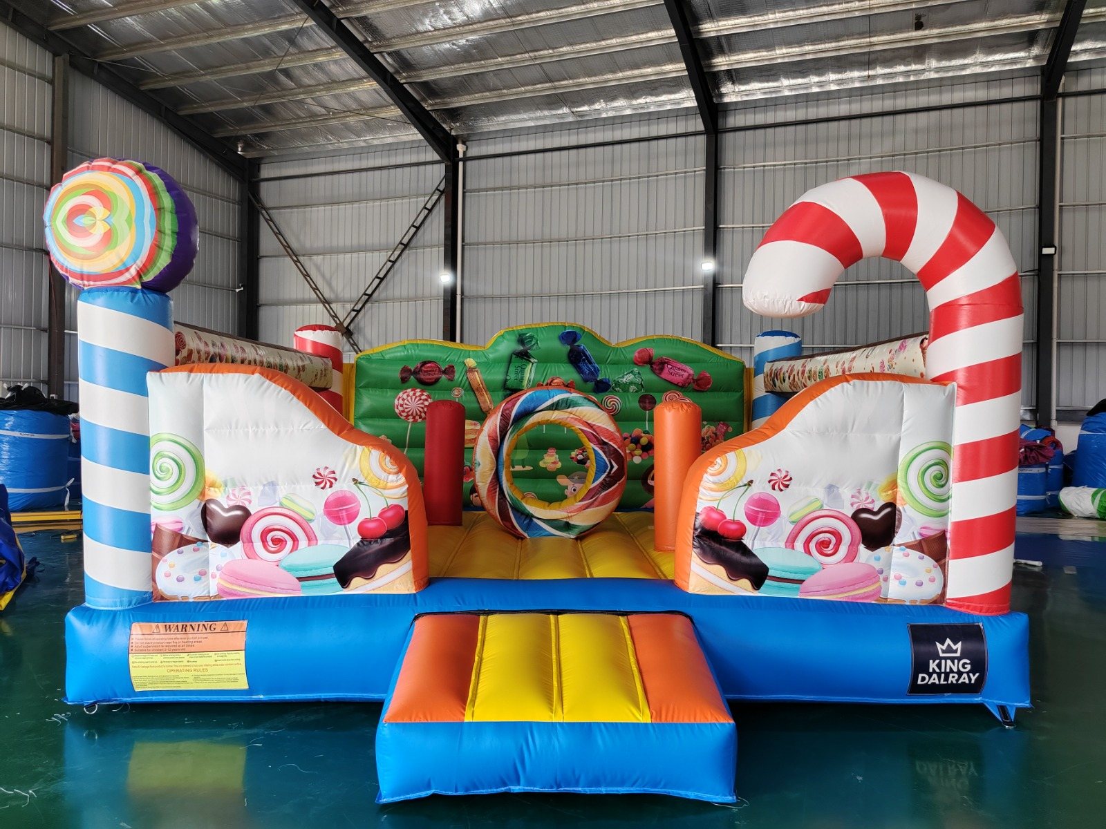 Front view of the colourful Candy Land inflatable castle