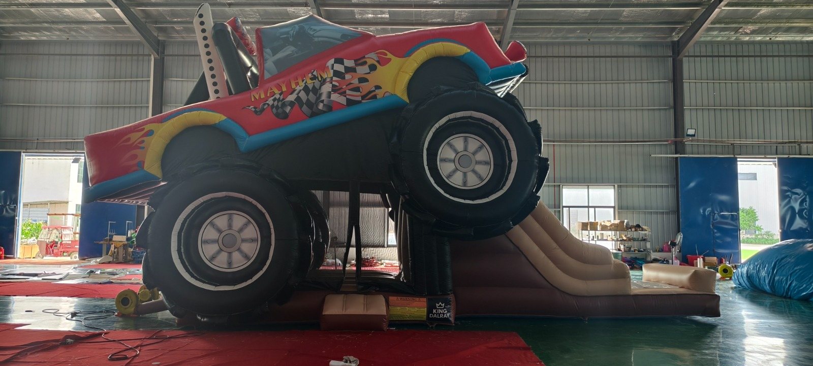Side view of the monster-truck inflatable slide