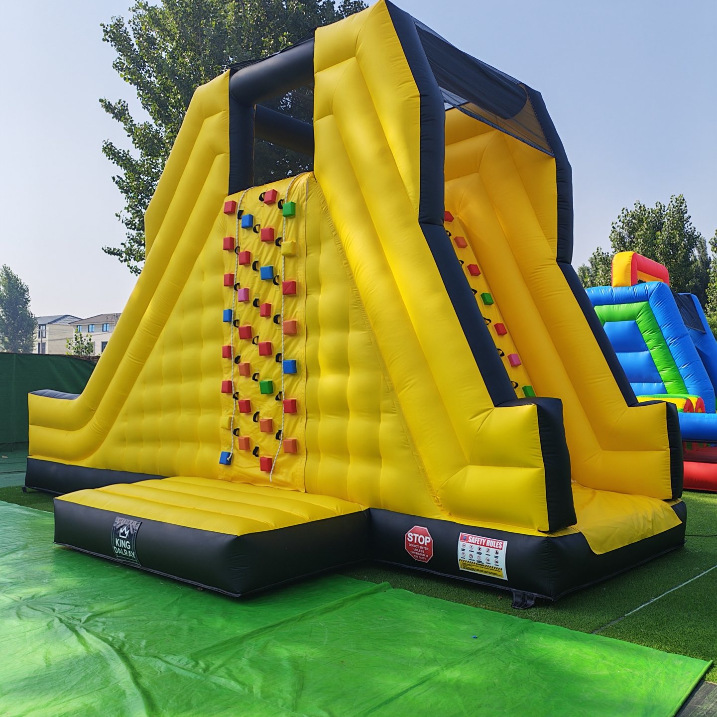 Second angled view of the yellow climbing slide